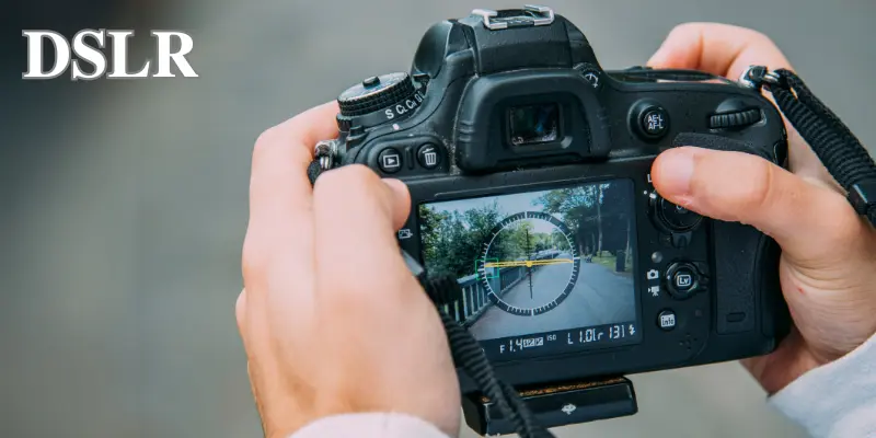 Dslr Camera In Use With Focus On Screen Showing A Scenic View, Perfect For Photography Enthusiasts.