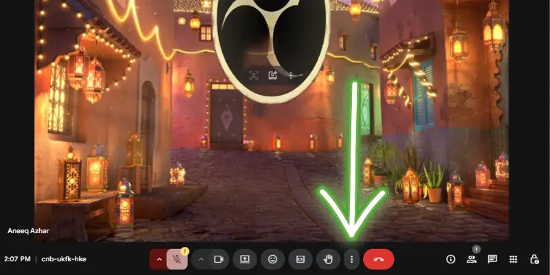 Google Meet Interface With A Virtual Background Showing A Scenic Street, And The Call Control Buttons Highlighted At The Bottom Of The Screen.