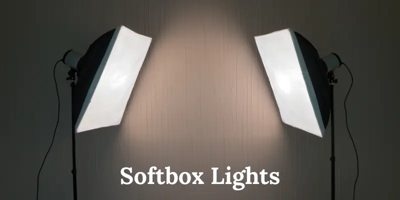 Two Softbox Lights Illuminating A Neutral Background For Photography Setup.